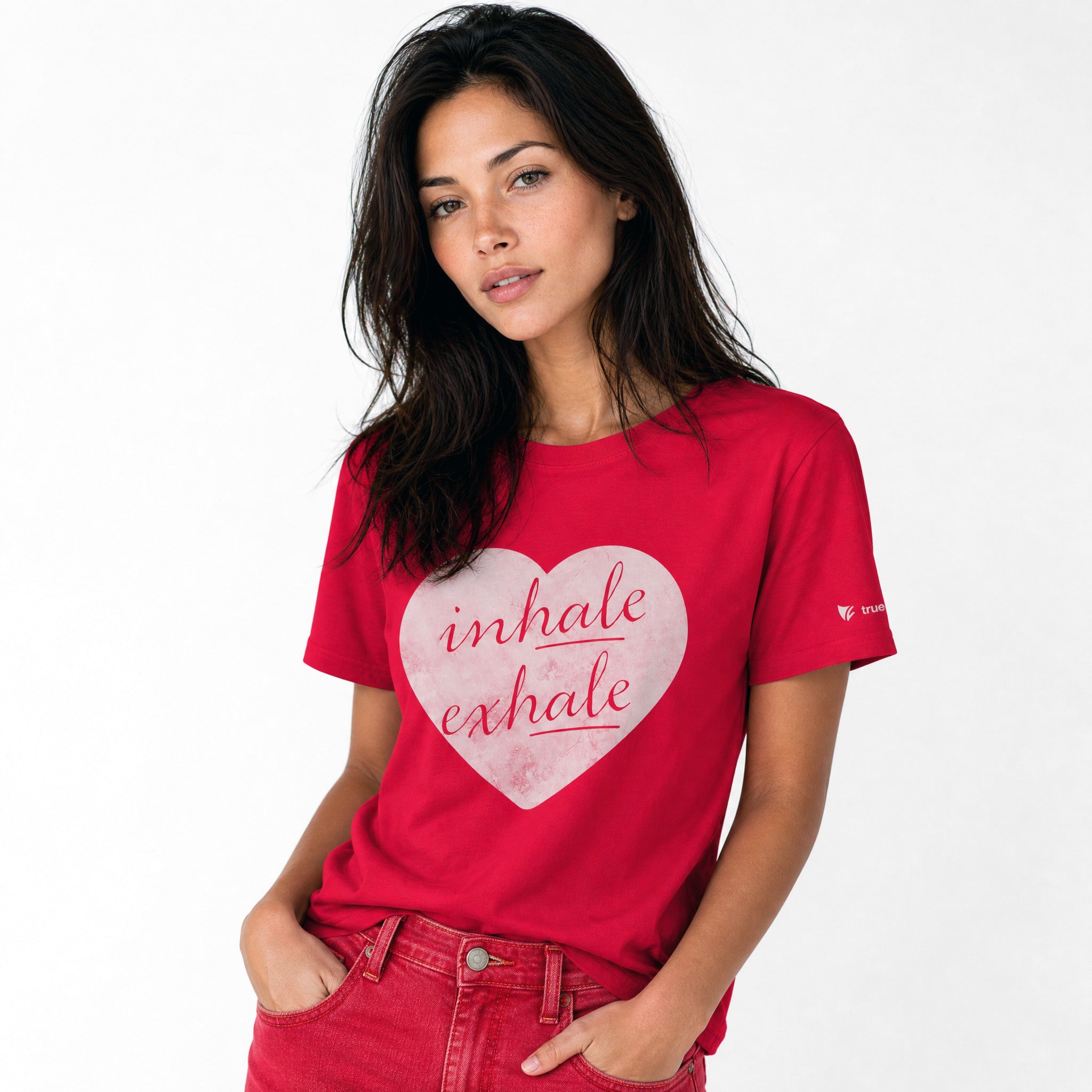 Woman wearing a red t-shirt with a heart design and text on a white background