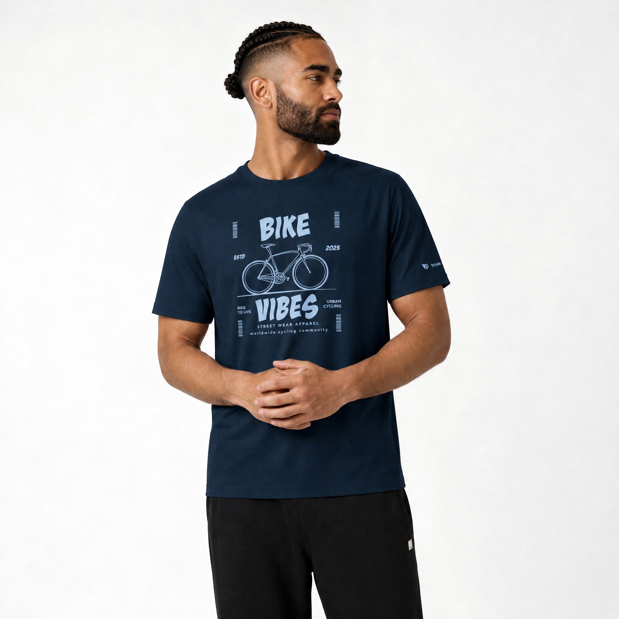 Man wearing a navy blue t-shirt with 'Bike Vibes' graphic on a white background
