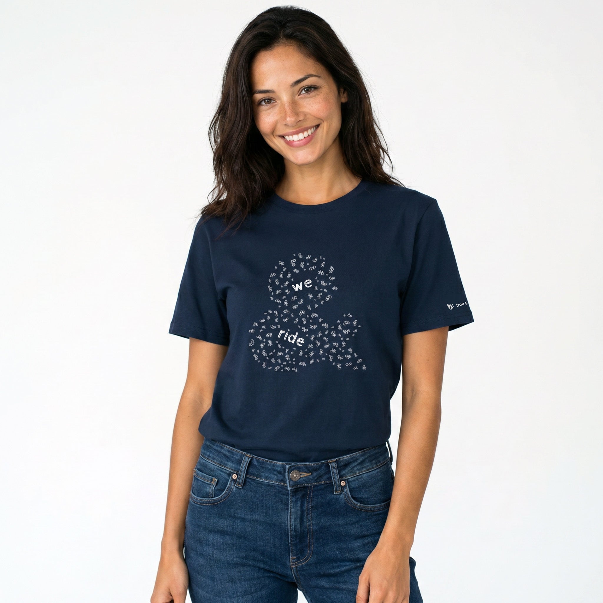 Woman wearing a navy blue t-shirt with a graphic design on a white background