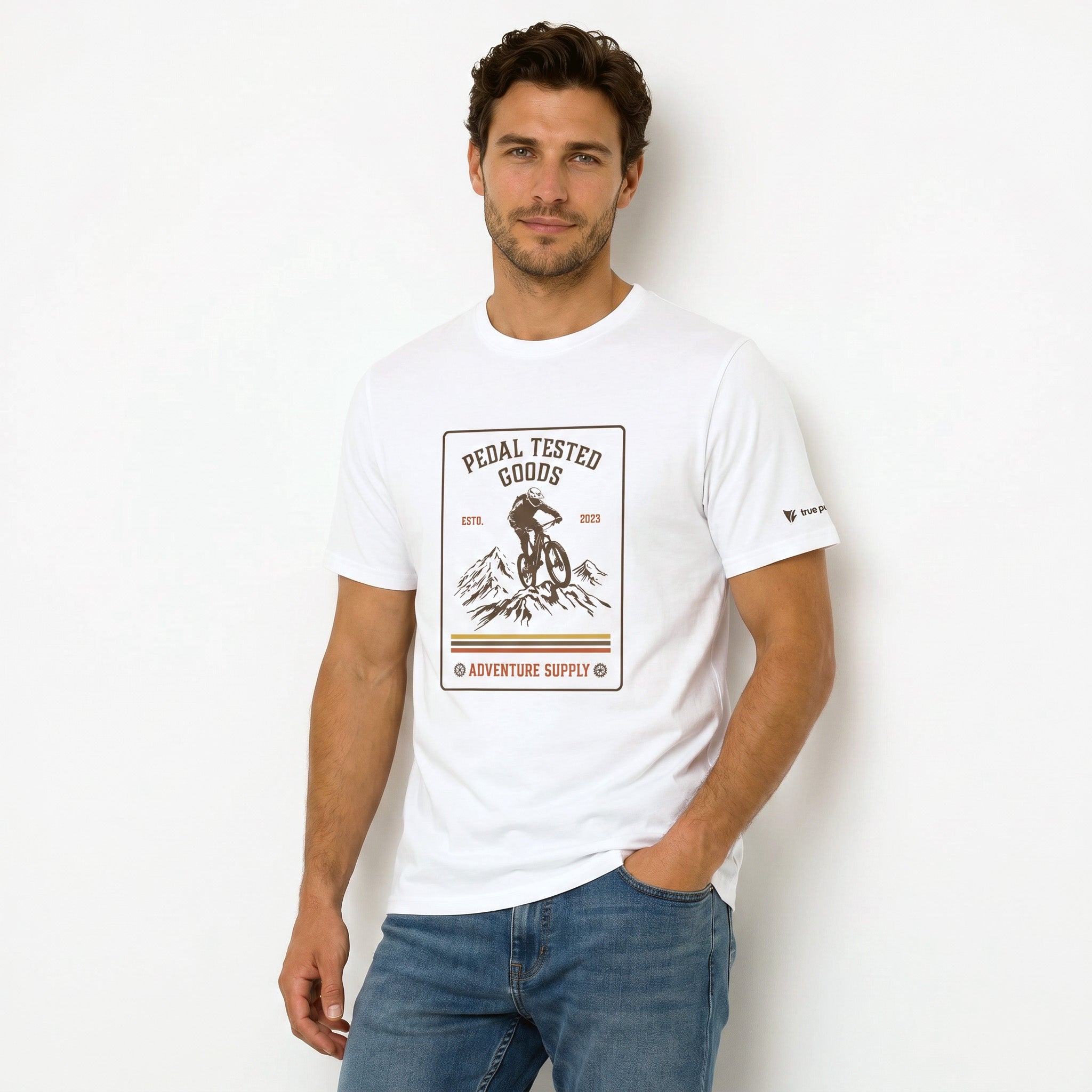Man wearing a white t-shirt with a graphic design on a plain background