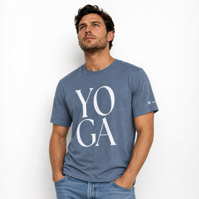 Man wearing a blue t-shirt with 'YOGA' printed on it against a white background