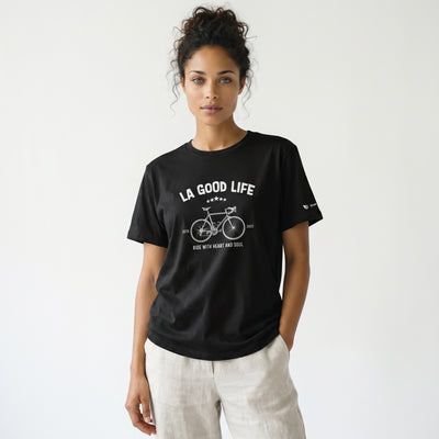 Woman wearing a black t-shirt with 'LA Good Life' graphic design on a white background