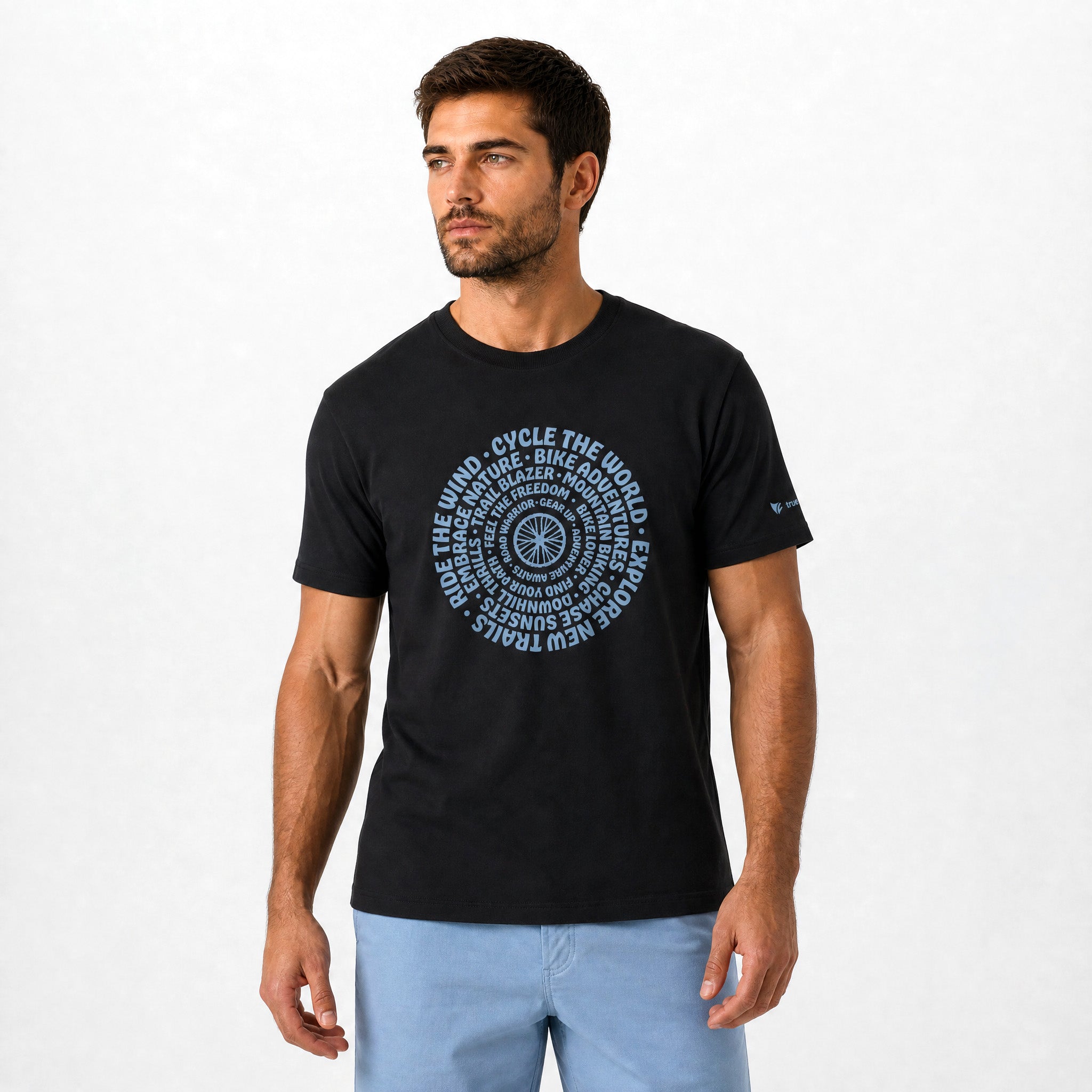Man wearing a black t-shirt with blue text and graphics on a white background