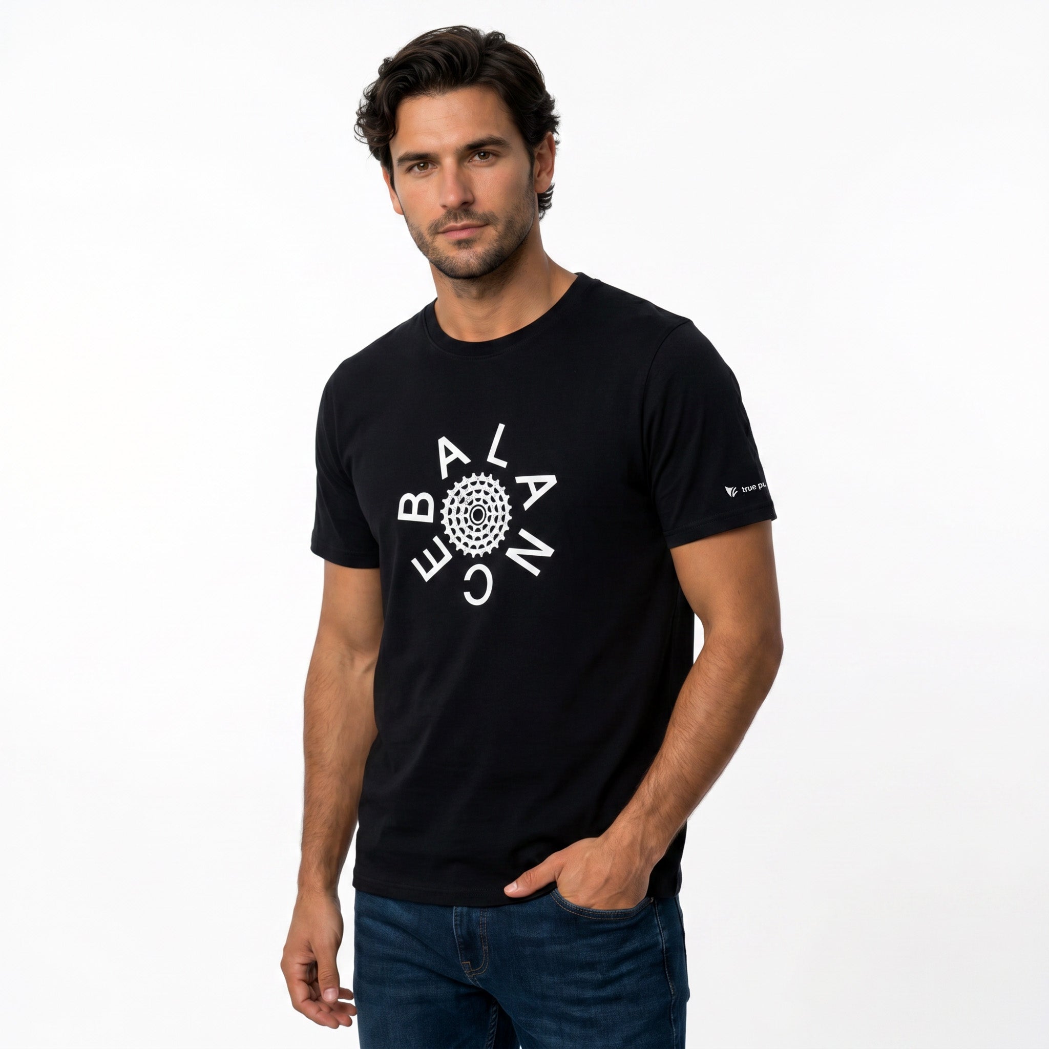 Man wearing a black t-shirt with a white logo on a white background