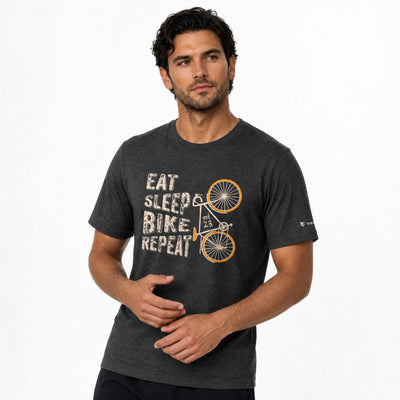 Man wearing a dark gray t-shirt with a bicycle graphic and text on a white background